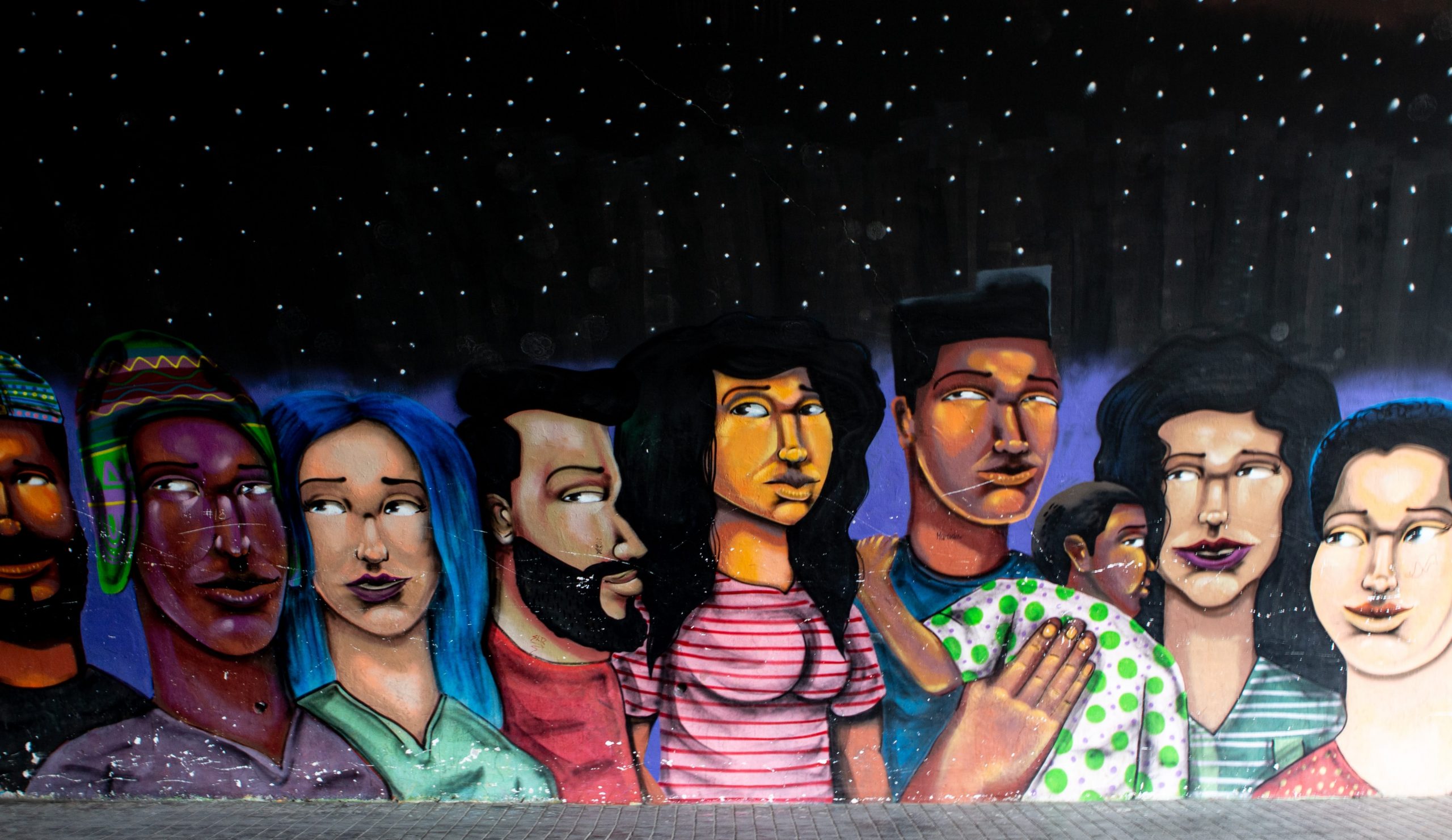 A mural of a diverse group of people